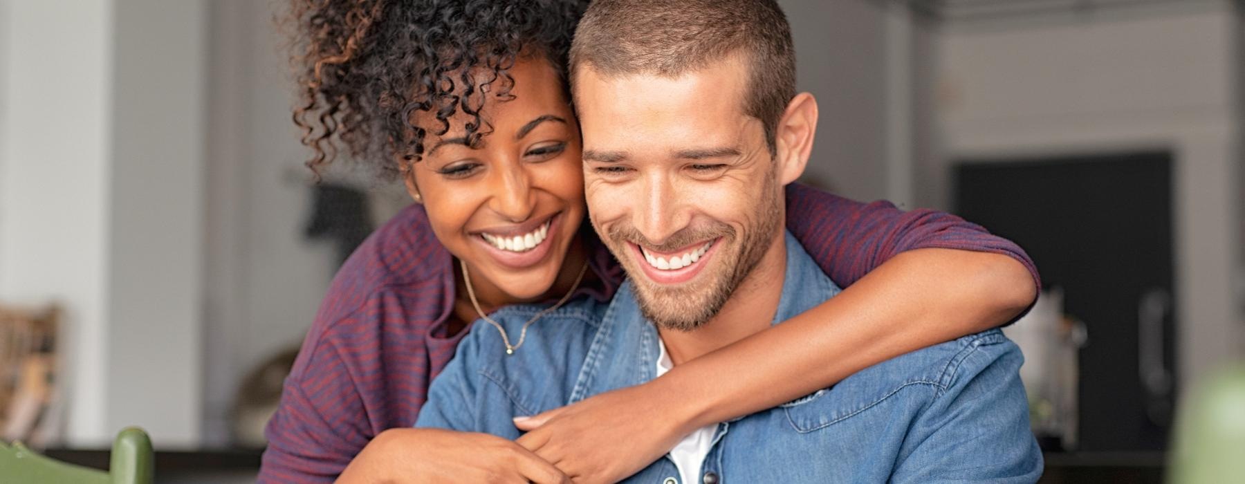 a man and woman embracing