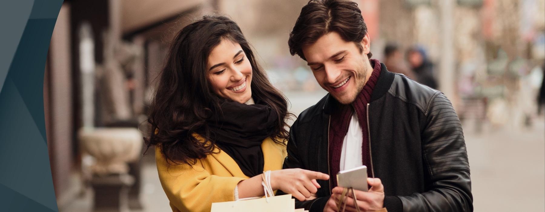 a man and a woman looking at a paper